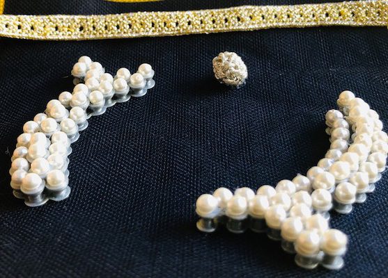 Thalassic Kaftan — Détail de couture — la perle prise dans le bourrelet